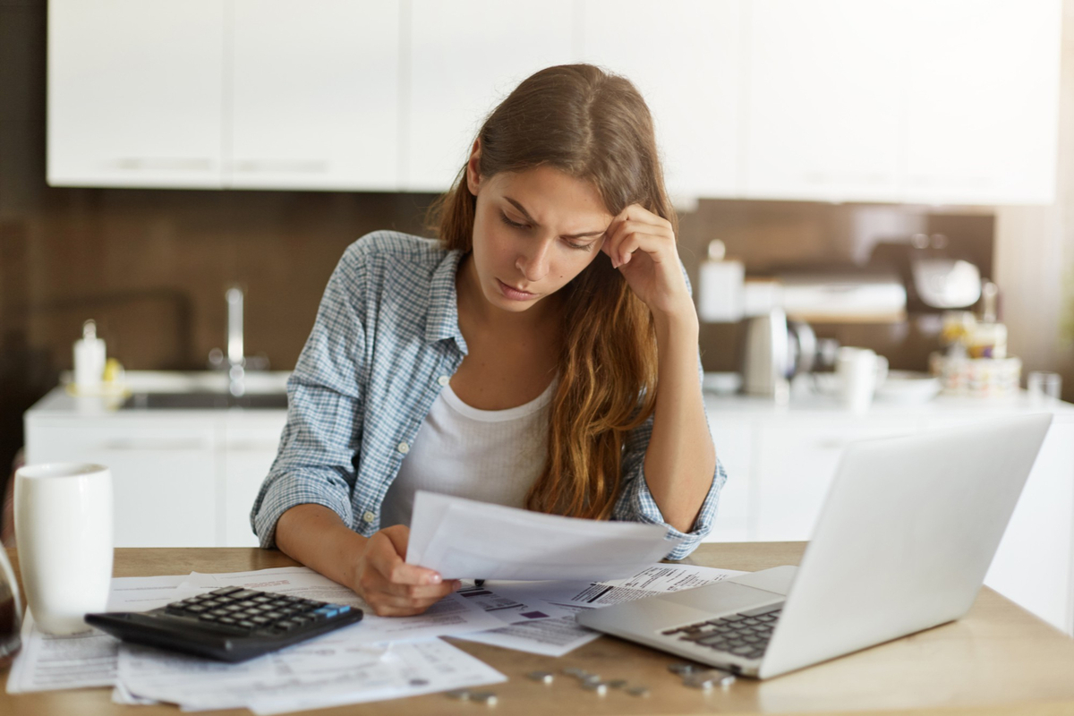 Woman looking at household bills