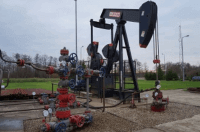 A close up of a small fracking operation with hydraulic drills and pumps
