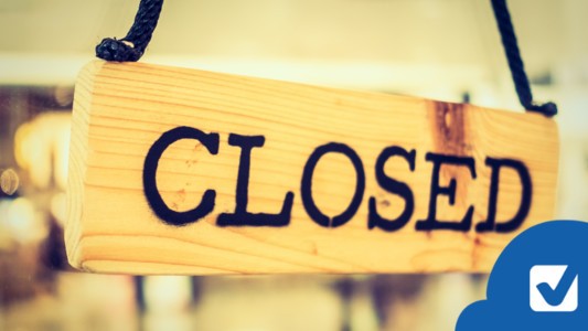Closed sign in store front window