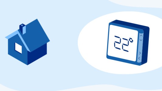 Smart thermostat next to house