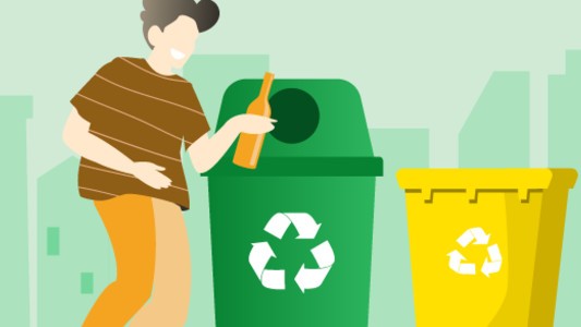 Image of a person using recycling bins