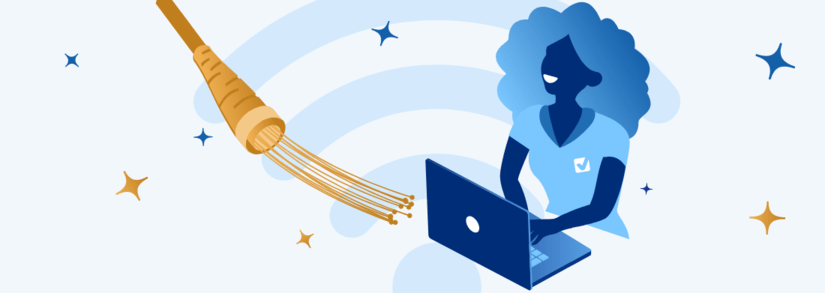 Person on a laptop next to a SIRO broadband cable